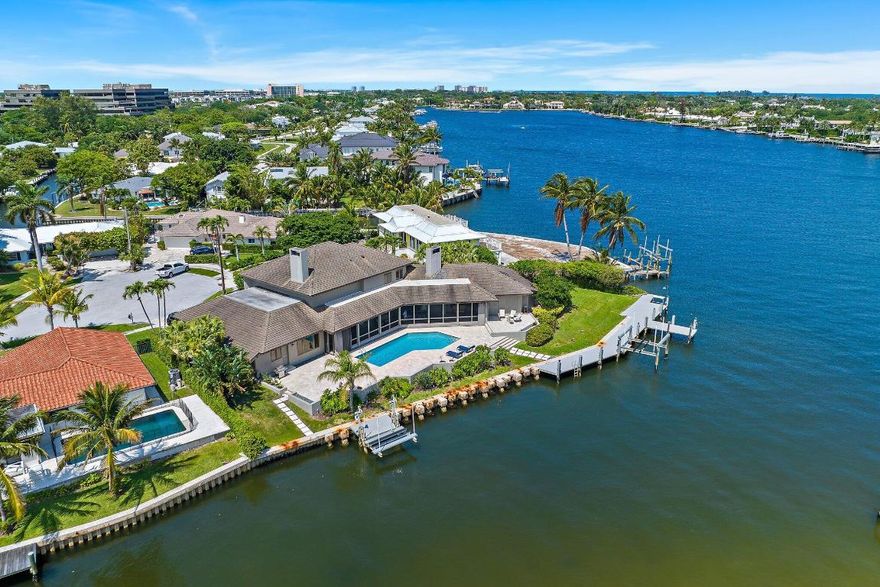 Rare opportunity offering 200' of deepwater frontage on one of North Palm Beach's most scenic lots!  This cul de sac home is located in HIDDEN KEY, a coveted private enclave East of US 1.   Custom built to feature organic design elements including true hardwood floors, plantation shutters, solid wood doors + pocket doors  Concrete Roof was replaced in 2011. Enjoy serene + secure living on Little Lake Worth (w/ easy Ocea n access). You can fish off your private dock! Water views from all main living areas. All bedrooms offer ensuite baths. Residents of North Palm Beach enjoy a newly renovated public country club w/ signature Jack Nicklaus golf, Olympic sized pool, fabulous tennis + wonderful indoor/outdoor dining overlooking the golf course. This home is just minutes to the best beaches, shopping, dining, educational and cultural venues.