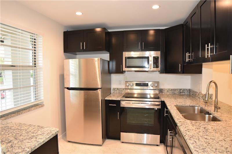 ALL AGES, completely remodeled, with permits, absolutely stunning 2/2 condo in the heart of Coral Springs. Kitchen renovated with granite counter tops, LG appliances, stove with WIFI and new cabinets. Bathrooms renovated with new cabinets, granite and new tile and tub in the guest bathroom. Master bath also renovated with new tile and shower. Brand new tile floor throughout. New plumbing. Impact windows. This one will not last.