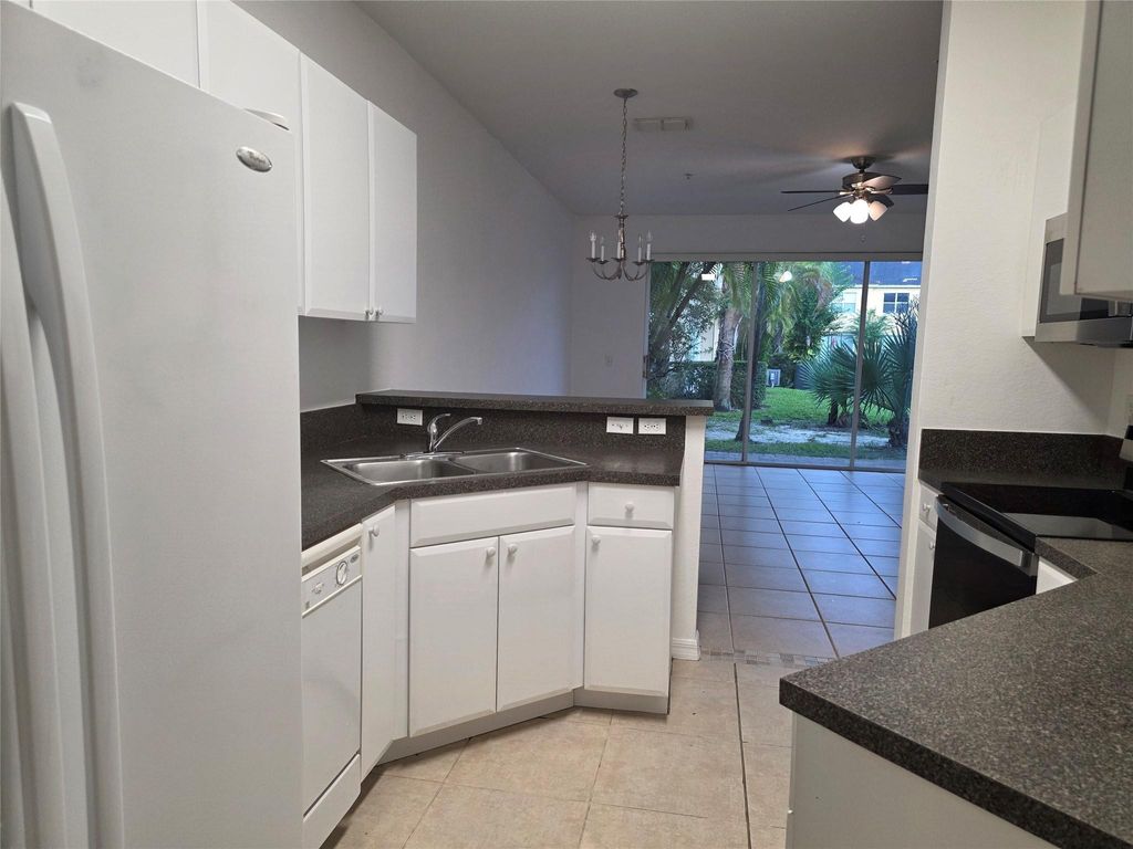 Photo of 960 Pipers Cay Drive #960, West Palm Beach, FL 33415 (MLS # F10527145)