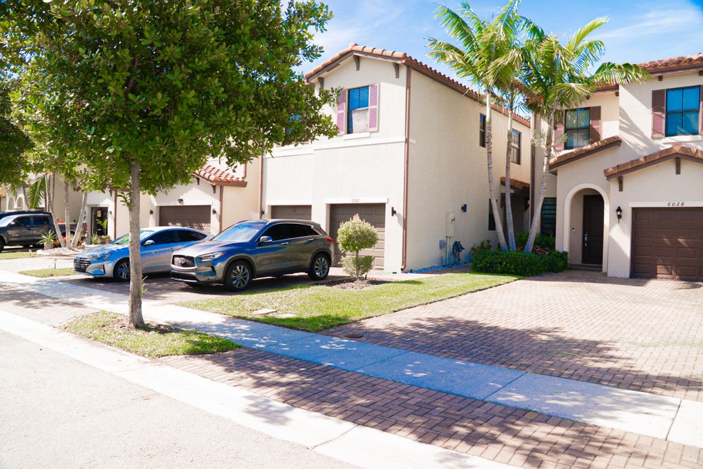 Photo of 6026 Pine Tree Way #6026, Riviera Beach, FL 33410 (MLS # B26016062)