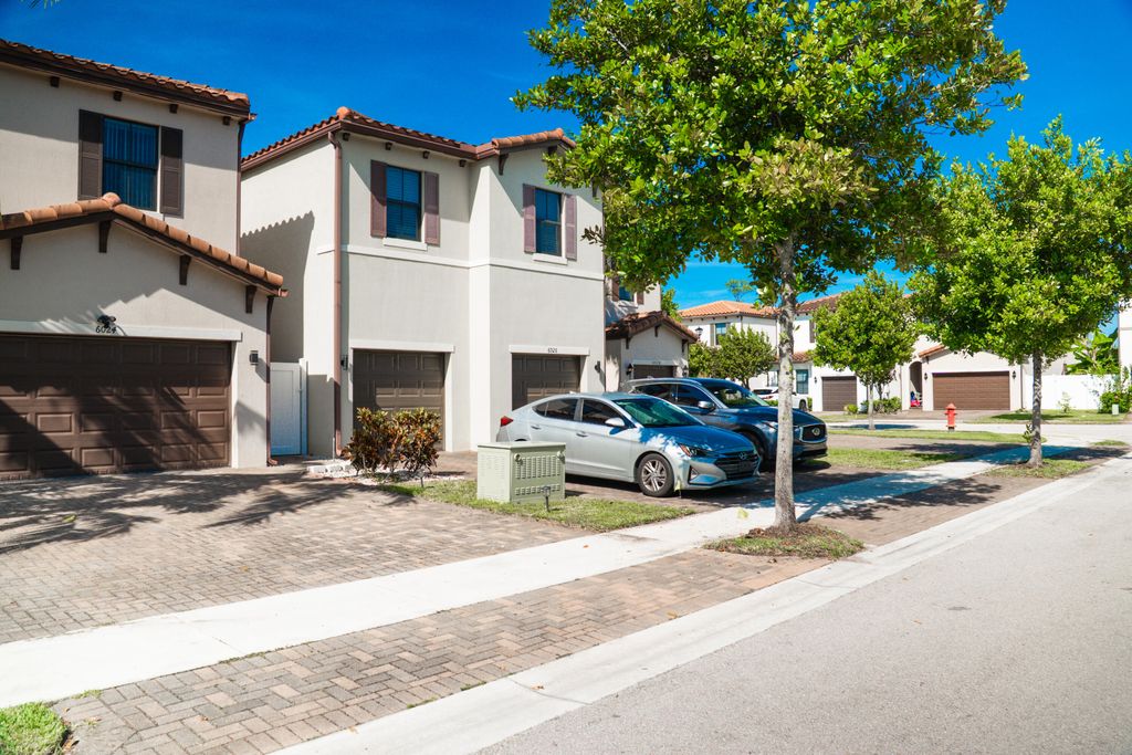 Photo of 6026 Pine Tree Way #6026, Riviera Beach, FL 33410 (MLS # B26016062)