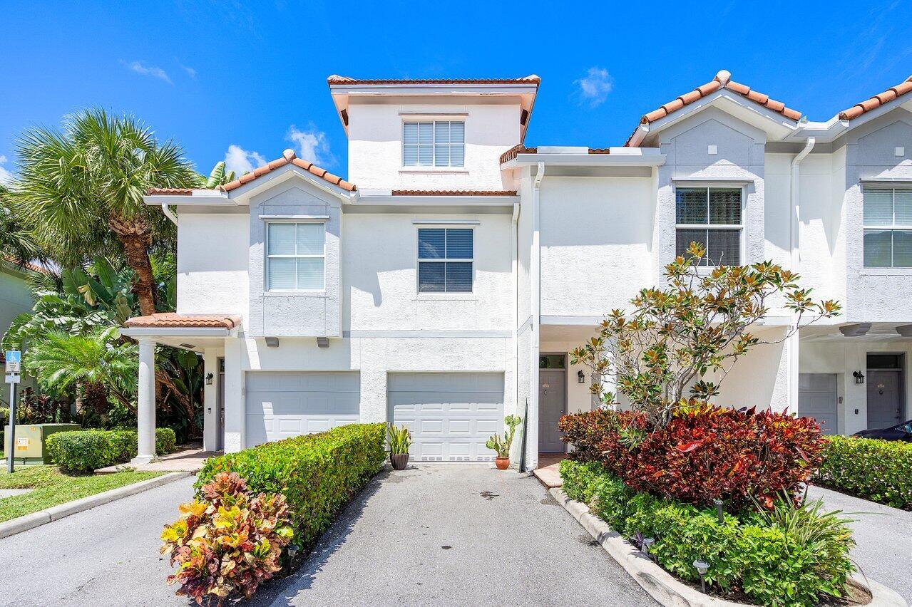 Rarely available, beautifully furnished three bedrooms and two full baths in the highly sought after community, Tierra Verde in East Delray. Fully furnished and completely renovated from floor to ceiling with a lake view. Relaxed living in a private gated community. Located less than two miles from beach, a few blocks from downtown Atlantic Ave. 3 story townhouse with spacious floor plan and an attached garage. It features three large bedrooms with Berber carpets. Italian porcelain tiled flooring throughout. Primary bedroom is equipped with a large walk-in custom built closet. Primary bath boasts double sinks, frameless glass walk in custom shower. S/S appliances, Samsung front loader washer/dryer. PGT impact windows. ONLY OFFERED FULLY FURNISHED. Monthly professional cleaning included.
