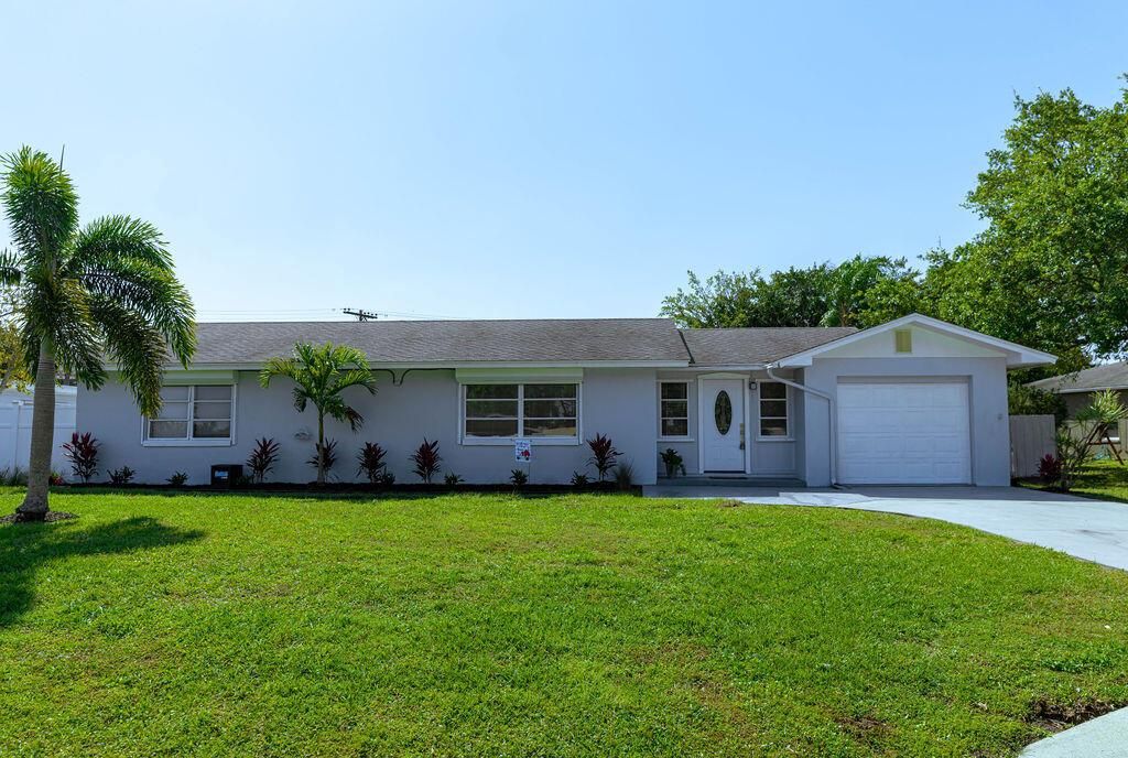 Photo of 710 NE Camino Street, Port Saint Lucie, FL 34952 (MLS # R10795572)