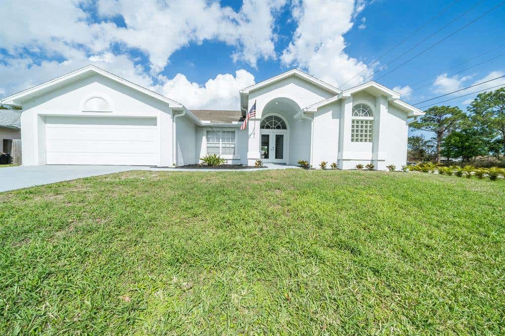 Photo of 101 SW Eyerly Avenue, Port Saint Lucie, FL 34983 (MLS # R10699964)