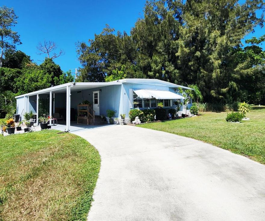 PRIVATE YARD at this 2 bed/2 bath CulDeSac home. Perfect for Privacy, Pets, Gardening, Barbecues & more! This Outdoor Green Oasis ideal for daytime relaxing or nighttime star gazing. Outdoor Patio offers space to entertain/unwind. Shed provides ample storage. Large Florida Rm serves as extra living room/den/home office. Master bedroom features en-suite bathroom & a spacious closet. AC 2025, Roof 2017 & these Floors are Solid. Very well maintained home w/ just a couple owners. PRIME LOCATION; near beach, grocery stores, post office, banks, hospitals, pharmacy, mall & more! Lot lease 865.27 includes lawn care, trash, free private golf course heated pool, pickleball, tennis, shuffleboard, bocce, gym, library, cards, Mahjong, bible study, wood workshop, dinners, parades, dances & more!