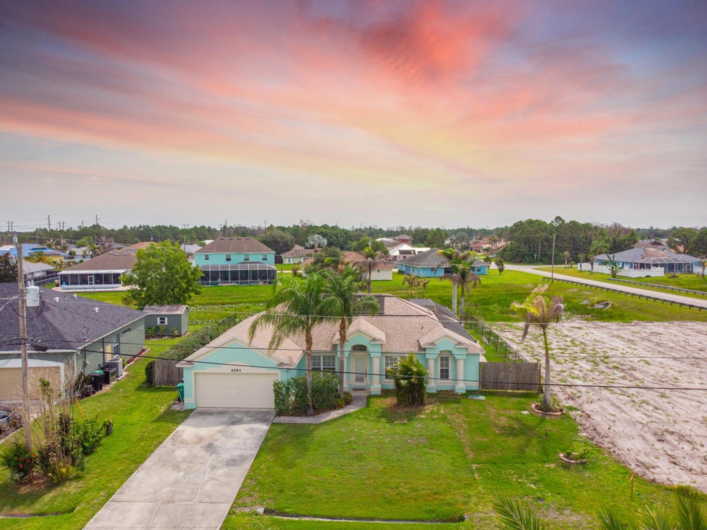Photo of 5593 NW Wesley Road, Port Saint Lucie, FL 34986 (MLS # B26044287)