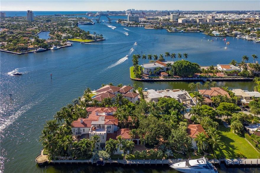 Opulent & regal point lot estate w/437' of deep WF & 170'+ full service, protected mega yacht dockage. Truly 1 of the most spectacular properties in all of South Florida w/astounding views. You are welcomed by rolling lawns & huge shade trees which grace this extraordinary property as you drive through the gate to the porte-cochere. Fully equipped chef's kitchen, formal dining room, stately master suite w/full marble bath. Finishes include magnificent limestone floors, beamed ceilings, wine cellar, elevator & fireplace. Full house generator optimized for hurricane coverage. Conveniently located close to DT FTL, shopping, fine dining, nightlife, air & seaports & major highways!! Interior design by Katia Bates creative director at Innovative Creations.