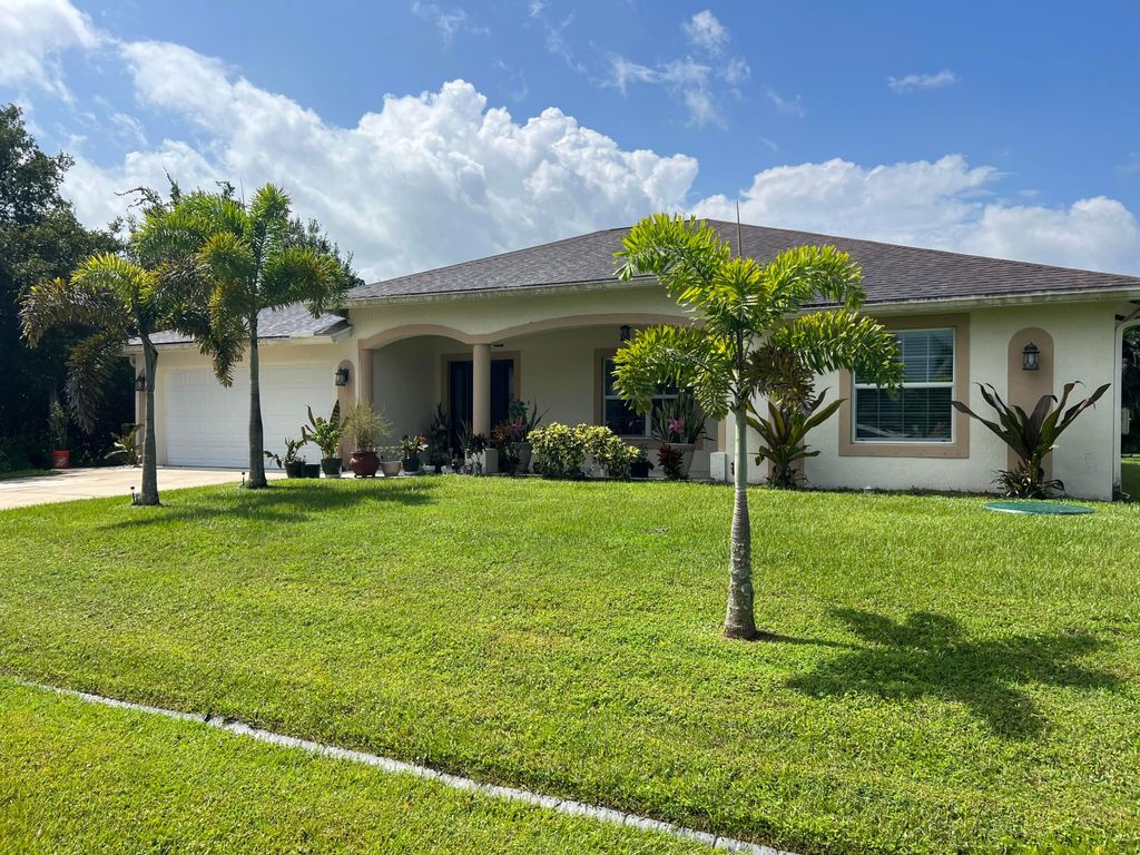 Photo of 6220 NW Sayers Avenue, Port Saint Lucie, FL 34983 (MLS # R10916139)