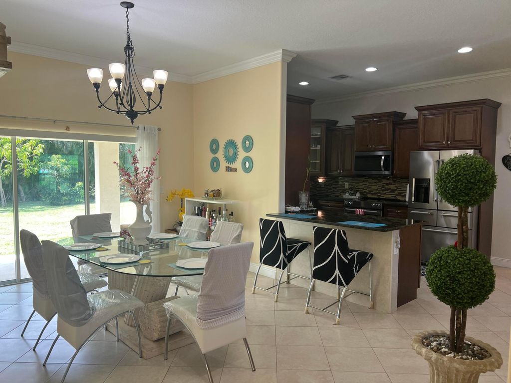 Photo of 6220 NW Sayers Avenue, Port Saint Lucie, FL 34983 (MLS # R10916139)