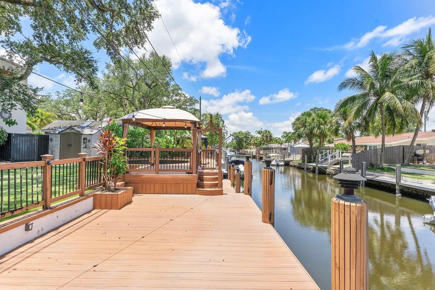 Discover a boater’s paradise with 60 feet of prime ocean-access frontage on the most picturesque street in Citrus Isles. This updated six-bedroom, four-bath home is designed for waterfront living, with expansive windows framing tranquil canal views. Entertain dockside with a waterside pavilion, generous deck, and rooftop perch perfect for sunset cocktails. The residence features soaring ceilings, a cozy fireplace, and oversized porcelain tile throughout. With impact windows and new roofing, this rare retreat offers both peace of mind and effortless access to the open ocean. OPEN Saturday 10/25 & 11/1 from 11-1 pm.