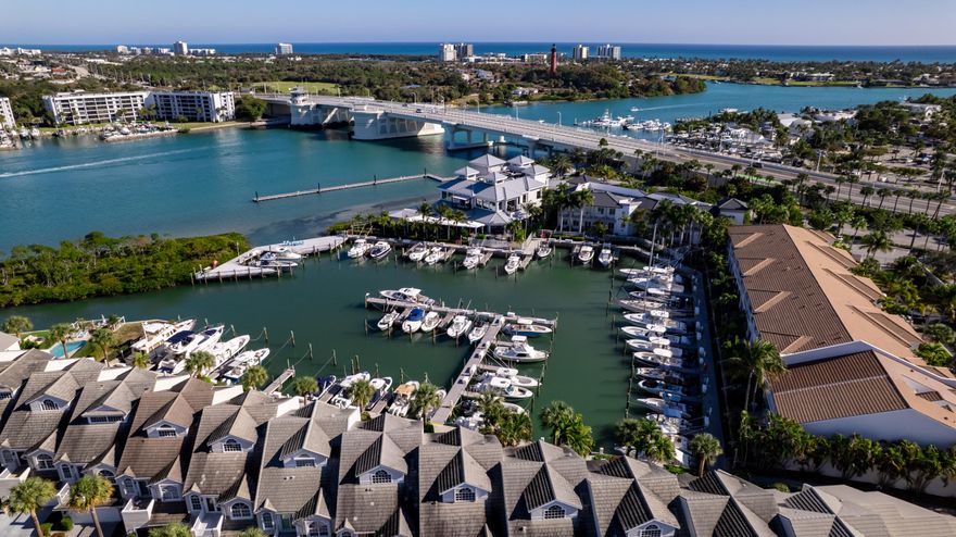 Welcome to the unparalleled Jupiter Harbour lifestyle where the intracoastal meets the Jupiter Inlet surrounded by incredible water views, lush green landscaping and walkability 10/10. Jupiter Harbour, just steps from all your favorite waterfront restaurants, is more than a community, it's a coastal paradise. With a 24/7 manned gate, a private marina where residents get first right of refusal (40' slip for sale) new tennis/pickle ball courts and resurfaced pool and spa, you'll find yourself living the full Jup Life. 

This fully gutted and renovated 2 bdrm/2 bath 3rd floor, roof top end unit with 8'-12' vaulted ceilings, impact windows/sliders, 2 balconies, log burning fireplace, new kitchen, appliances, bathrooms and storage is a rare find in JH. No neighbors above or to side. (MORE) The newly opened and raised ceiling floor plan enhances the experience and provides for increased cabinets and storage.  Both bedrooms lead out to waterfront balconies and the oversized master boasts room for desk or reading space.

Live with confidents in security behind the 24/7 manned gate along with full time on site property manager and maintenance team.  This community has truly been maintained meticulously passing the 10 year engineering study with ease and new roof in 2025.

Enjoy the boats cruising by along with a backyard garden view flush with beautiful tree lined sidewalks and the "resident" birds and bunnies. Lounge in/by the heated pool and spa with wide water views or enjoy your own private beach within the gates.  

Walk to Michael Jordan's 1000N restaurant neighboring the private marina or to Utiki, Jetty's, Pelican Club, Beacon, Topside, Lucky Shuck, Square Grouper, Guanabanas, Schooners, Lighthouse Cove Putt Putt, Jupiter Dunes Par 3 GC and the myriad of restaurants and shops at Jupiter Harbourside.

Grab your golf cart or bike to Dubois Park, the pier and Jupiter and Juno Beach. 

Enjoy seemingly endless water views, pool views, sunsets from balcony and Jupiter Lighthouse and Tennis/Pickleball Courts from front.