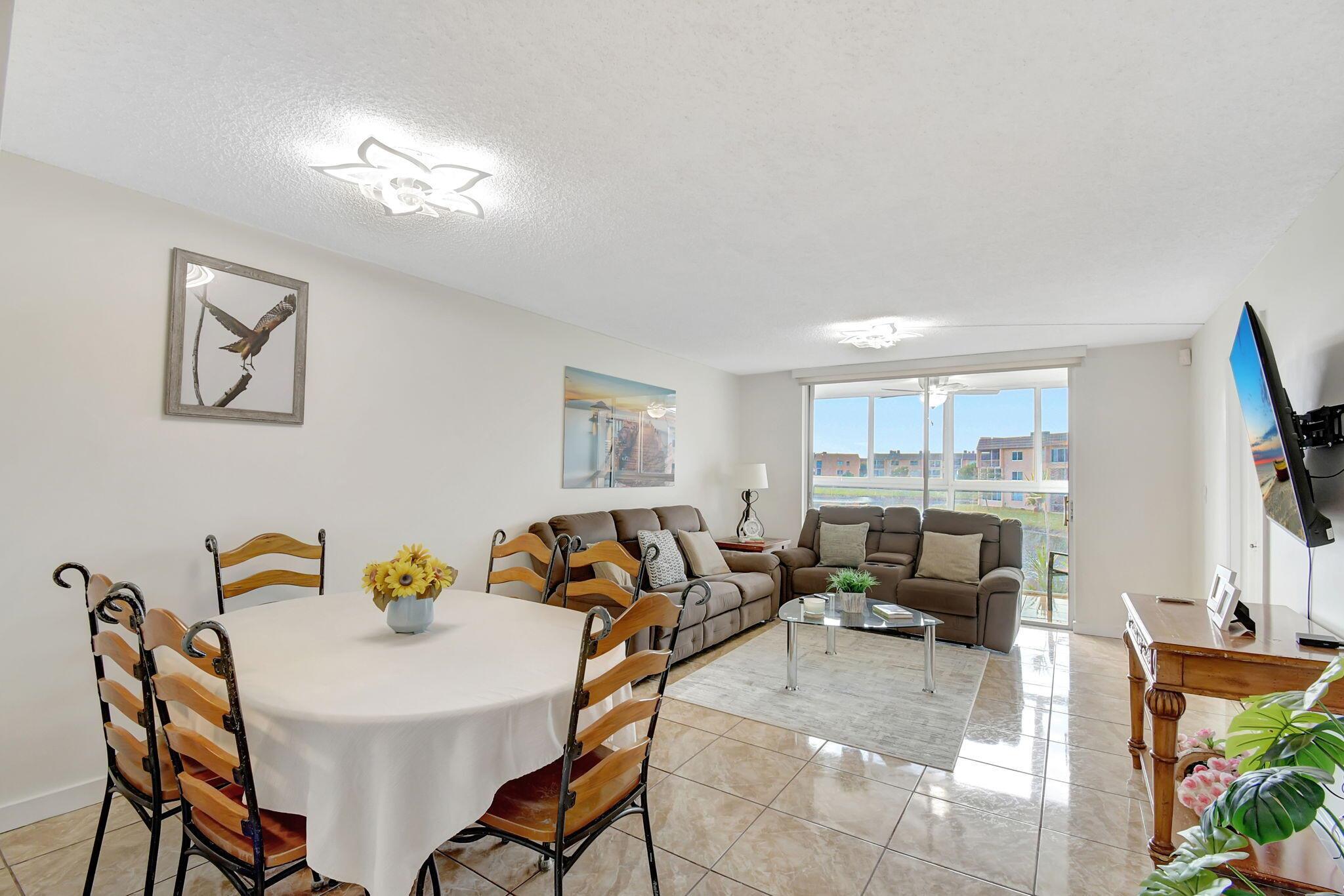 Bright and Beautiful 2/2 Condo. Discover your dream home in this quiet, stunning Apartment. This beautifully upgraded unit features a modern kitchen ,Impact windows including patio. updated bathrooms, and spacious walk-in closets. Enjoy breathtaking lake views from your patio. New AC 2023.Sunrise Lakes 3 offers 9 hole golf course, Tennis, Pickleball, shuffleboard Fitness facility year-round,, 7 pools including indoor pool and Jacuzzi, Ballroom, theater. there's always something to do!