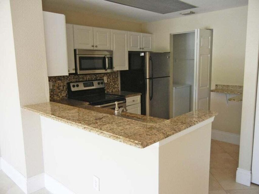Photo of 2813 Grande Parkway #109, Palm Beach Gardens, FL 33410 (MLS # R11025014)