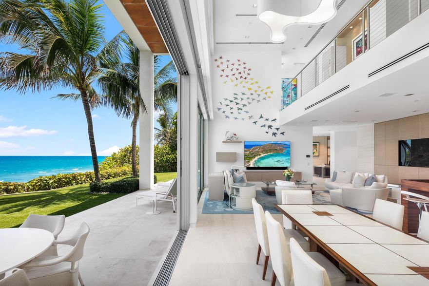 Oceanfront luxury has a new address. Welcome to Casa Blanca at 3719 S. Ocean Blvd in Highland Beach. 
This contemporary coastal gem is an ode to the luxurious lifestyle that Highland Beach has to offer. Casa Blanca offers innovative architecture that stirs the senses with a rare mix of contemporary splendor, artisanal craftsmanship and resort-style comfort. 
Completed by Cudmore Builders in 2016, this sprawling estate spans 12,791 SF across its multiple stories and features 100 FT of glittering ocean frontage. The impressive custom estate establishes an unmistakable regal tone. Upon entering the estate, one finds themselves enthralled by the panoramic ocean views and  bespoke sculpture by Raymond Karpuska. The great room wall also features a bespoke art installation by Karpuska, accenting the soaring ceiling in the living space with colorful swallows.
Interior spaces at Casa Blanca enchant with clean contemporary design by renowned Susan Lachance. Expansive windows invite an abundance of natural light, creating a harmonious blend between indoor and outdoor living. 
Casa Blanca boats six bedrooms, eight full baths and two half-baths. Every suite within the property is carefully crafted with great attention to detail. The primary suite stands out in its unparalleled allure, boasting a captivating and private ocean view that embodies a tropical oasis. Its meticulously designed primary bathroom features floors and walls clad in marble, a dual rainfall shower, dual sinks, and a boutique-style closet. 
The formal living area wows with a show-stopping tank crafted by the experts at Living Color Aquariums. Dramatic marble flooring adds to the layout's ethereal vision, lending an aura of refined opulence to each room. The spacious gourmet kitchen extends the luxury thread with state-of- the-art appliances from high-end brands like Miele and Sub-Zero. 
The enchanting oasis includes a sparkling saltwater pool, a summer kitchen, and a private outdoor shower embraced by lush landscaping that enhances your sense of bliss and seclusion. 
Transcend the expected at Casa Blanca.