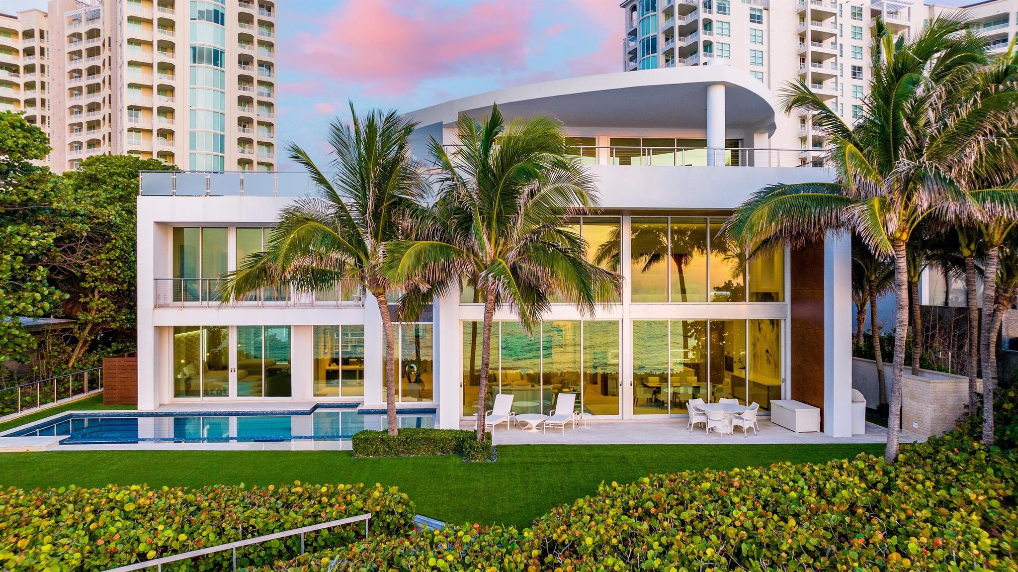 Oceanfront luxury has a new address. Welcome to Casa Blanca at 3719 S. Ocean Blvd in Highland Beach. This contemporary coastal gem is an ode to the luxurious lifestyle that Highland Beach has to offer. Casa Blanca offers innovative architecture that stirs the senses with a rare mix of contemporary splendor, artisanal craftsmanship and resort-style comfort. Completed by Cudmore Builders in 2016, this sprawling estate spans 12,791 SF across its multiple stories and features 100 FT of glittering ocean frontage. The impressive custom estate establishes an unmistakable regal tone.