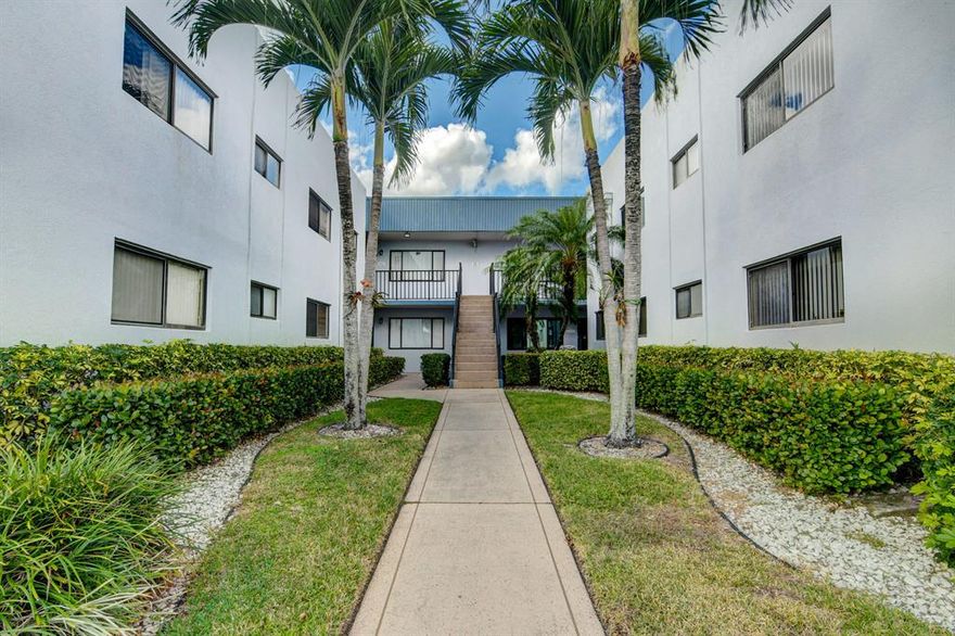 Every day is more exciting in this lovely ground floor condominium located in the desirable Lakes of Delray neighborhood. Charming open-concept floor plan. Kitchen offers plenty of cabinet and counter space plus direct access to the adjoining dining area. Bedrooms feature spacious closets and direct balcony access. Screened balcony offers a perfect place for extra seating, dining and entertaining space. Convenient laundry room features storage and full-size washer/dryer. You'll love life in gated Lakes of Delray, offering a host of complimentary clubs, classes and organizations all year long. This active adult community features multiple pools, spas, tennis and pickle ball courts, plus a clubhouse with fitness studio.