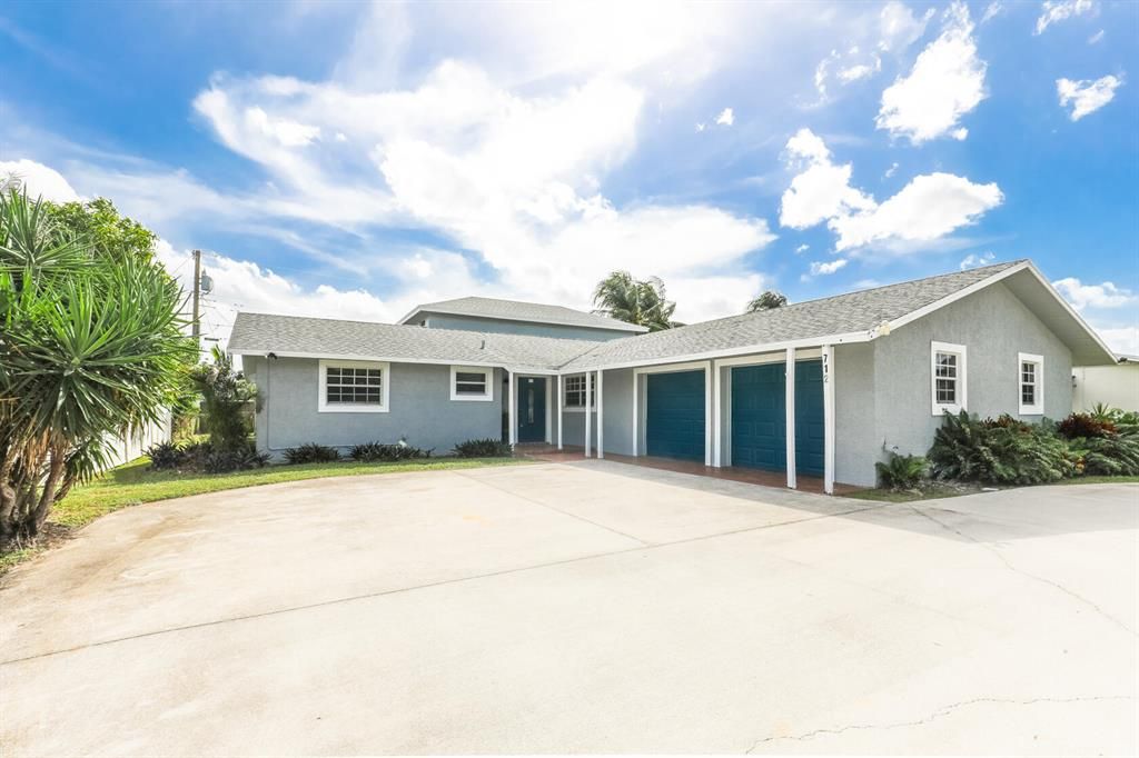 Photo of 712 Northern Drive, Lake Park, FL 33403 (MLS # R10755949)