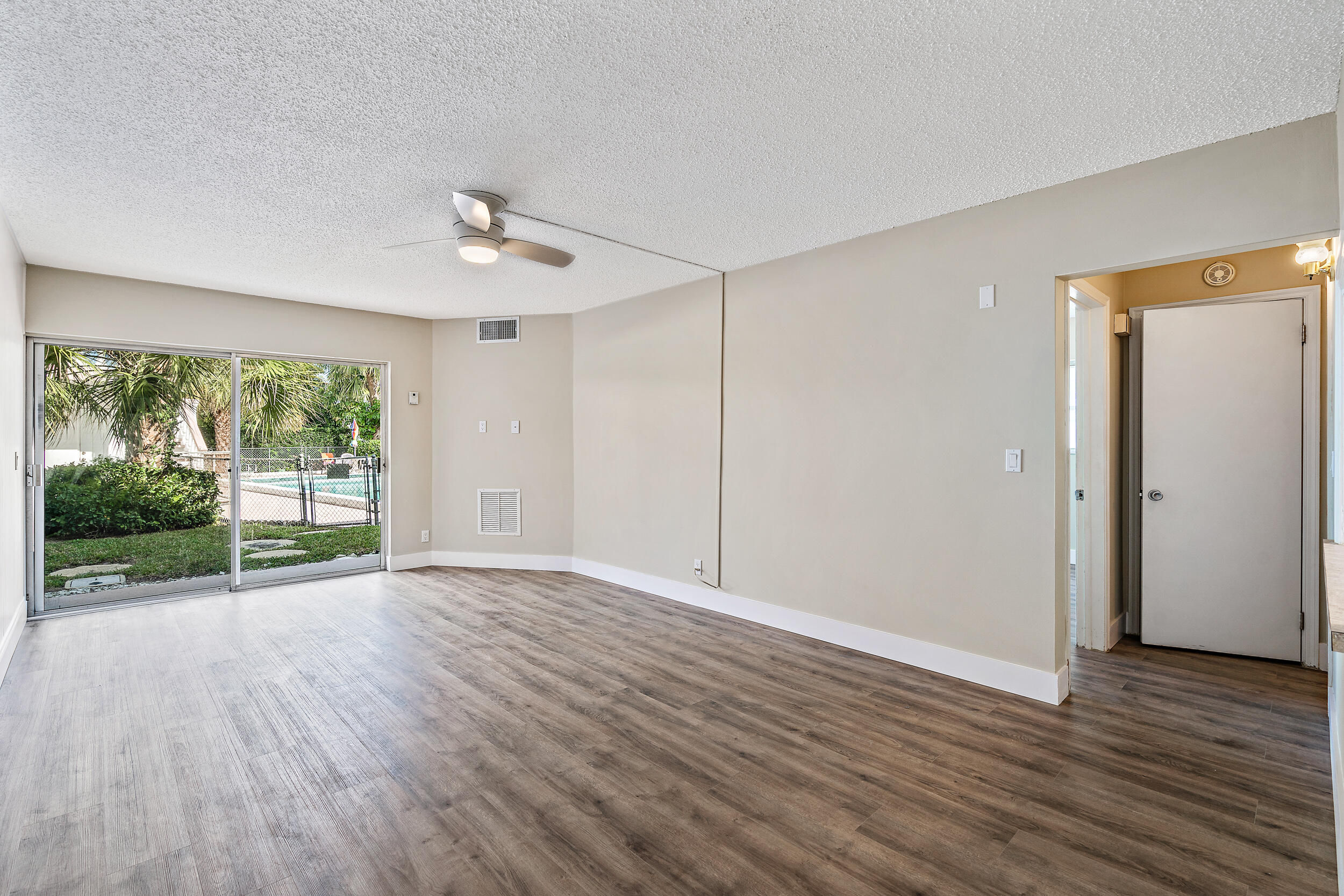 FRESH PAINT, BRAND NEW FLOORS, refreshed and ready for a new tenant! Adorable one-bedroom corner unit condo with views of the pool! Available for immediate occupancy (February 22, 2022), in prime location of the highly sought after Village of North Palm Beach! Condo features include fresh paint, bright white kitchen with views to the pool, new flooring, and a large walk-in closet in the master, and easy access parking. Rent includes cable TV. Corinthians is a quaint, boutique condo building directly across the street from North Palm Beach Country Club and comprised of 14-units. The community has older amenities but is full of character and conveniently located to all that the Palm Beaches have to offer.