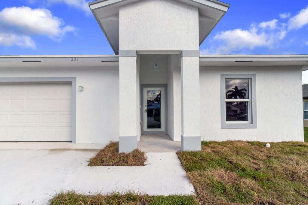 Photo of 231 SW Moselle Avenue, Port Saint Lucie, FL 34984 (MLS # R11091182)