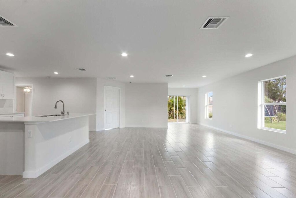 Photo of 231 SW Moselle Avenue, Port Saint Lucie, FL 34984 (MLS # R11091182)