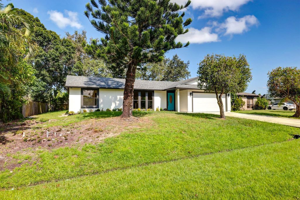 Photo of 631 NE Helicon Lane, Port St Lucie, FL 34983 (MLS # R10918938)