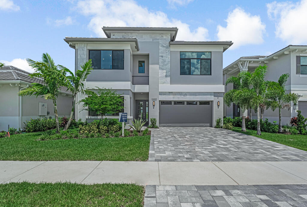 Discover the Polaris model in Apex at Avenir, a stunning new-construction home in Palm Beach Gardens offering 4,267 sq. ft. of luxury living on Lot 333. This two-story design features 5 bedrooms, 7 full baths, a loft, and a 2-car garage. Highlights include high ceilings, open living and dining spaces, and a gourmet kitchen with quartz countertops and premium GE appliances. The lavish primary suite boasts a spa-inspired bath for ultimate relaxation.