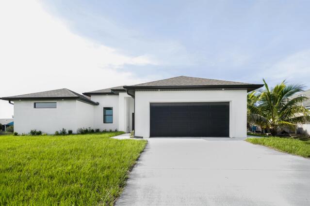 Enjoy this beautiful New Construction Home with 3 bedrooms plus den and 2 baths. The open floor plan makes this home very spacious. with its tile floors and stylish fixtures. Stainless steel appliances and quartz countertops match seamlessly with the European style cabinets. With a bathroom equipped with his and hers sinks, a walk in shower and tub. This home equipped with hurricane impact windows and doors.