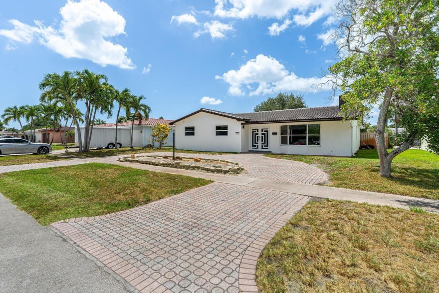 Here it is, the one you've been waiting for. This properly has been meticulously remodeled with exquisite modern finishes throughout. Chef's dream kitchen with high-end appliances, waterfall quartz counters, an oversized island and many more designer touches. A spacious and flowing floorplan with custom LED lighting throughout makes this home open and airy. The bathrooms have been tastefully designed to look like something out of a magazine. Outside features a screened patio and pool enclosure that makes it easy to enjoy the south Florida outdoor lifestyle. Resurfaced pool and patio area is perfect for entertaining! With far too many features to list, you must come and discover the superior craftsmanship throughout this home.