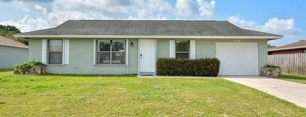 Photo of 316 SE Fairchild Avenue, Port Saint Lucie, FL 34984 (MLS # R10800355)