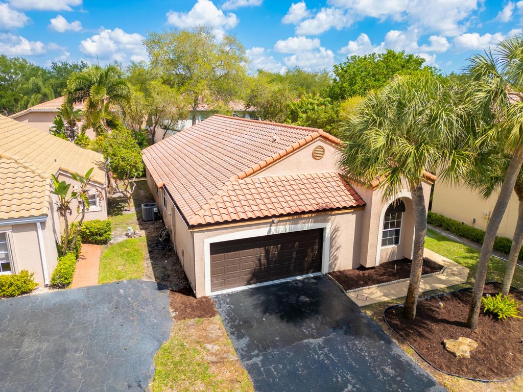 Photo of 6185 NW 77th Place, Parkland, FL 33067 (MLS # B26009435)