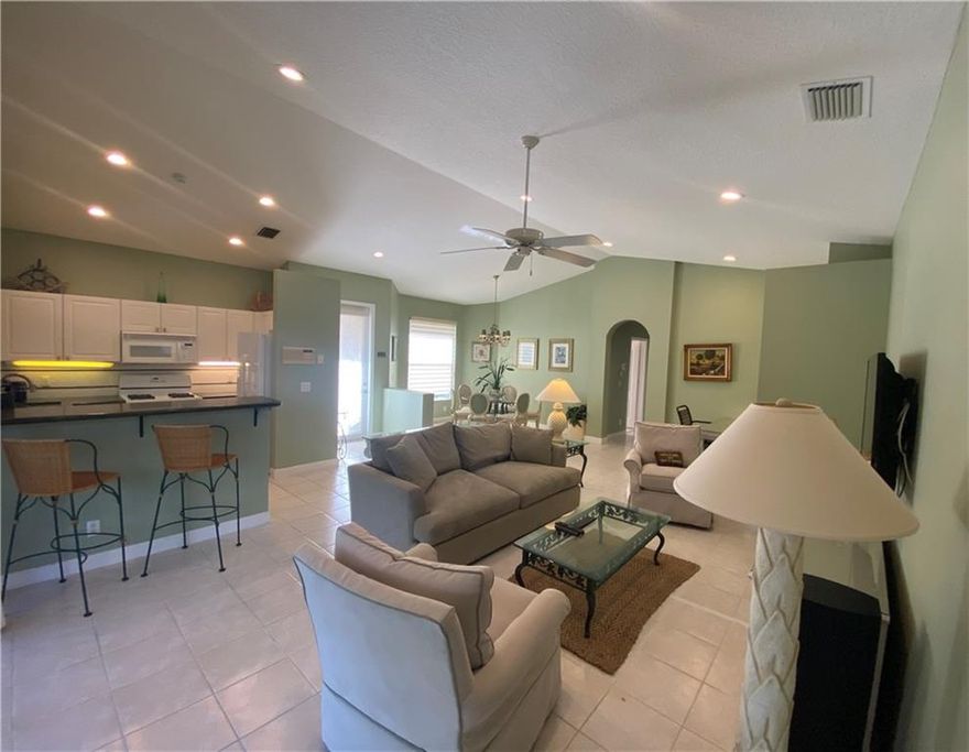Fully furnished open floor plan concept with two bedrooms, two bathrooms, and a two-car garage. Oversized screen-covered patio perfect for entertaining. New a/c unit, ceramic tile floors throughout except for the bedrooms with carpet. Ibis Golf and Country club is a GATED resort-style community with an 80,000 SF clubhouse which includes: a spa, restaurants, fitness center, etc.   There are three premier Golf courses. TURNKEY! Mandatory membership is required in Ibis PLUS  a minimum social membership. $50,000 MANDATORY NON-REFUNDABLE MEMBERSHIP IS REQUIRED.