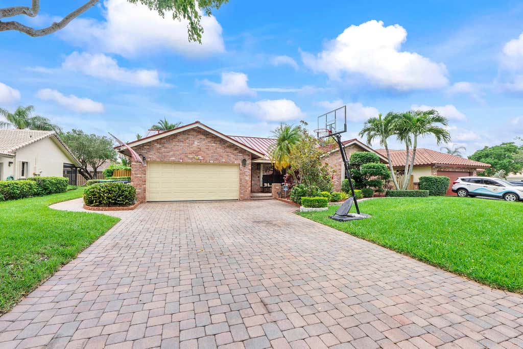 Photo of 10662 NW 7th Place, Coral Springs, FL 33071 (MLS # B26048011)