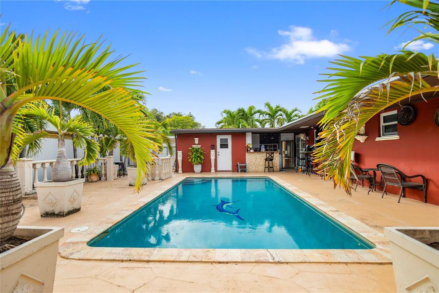 Beautiful single-family home located in the heart of Miami Gardens! This spacious property features 3 bedrooms and 3 bathrooms, plus an additional outdoor bathroom, perfect for pool days and entertaining. Enjoy a private pool area with a fully equipped outdoor kitchen, ideal for gatherings and family enjoyment.The home offers plenty of outdoor space, surrounded by fruit trees, creating a peaceful and enjoyable environment. New roof installed one year ago with permits, providing peace of mind to the new owner.Excellent location, conveniently close to Florida’s Turnpike and just minutes from Hard Rock Stadium, shopping, dining, and major highways. CORNER LOT !!A must-see property with great potential—don’t miss this opportunity!