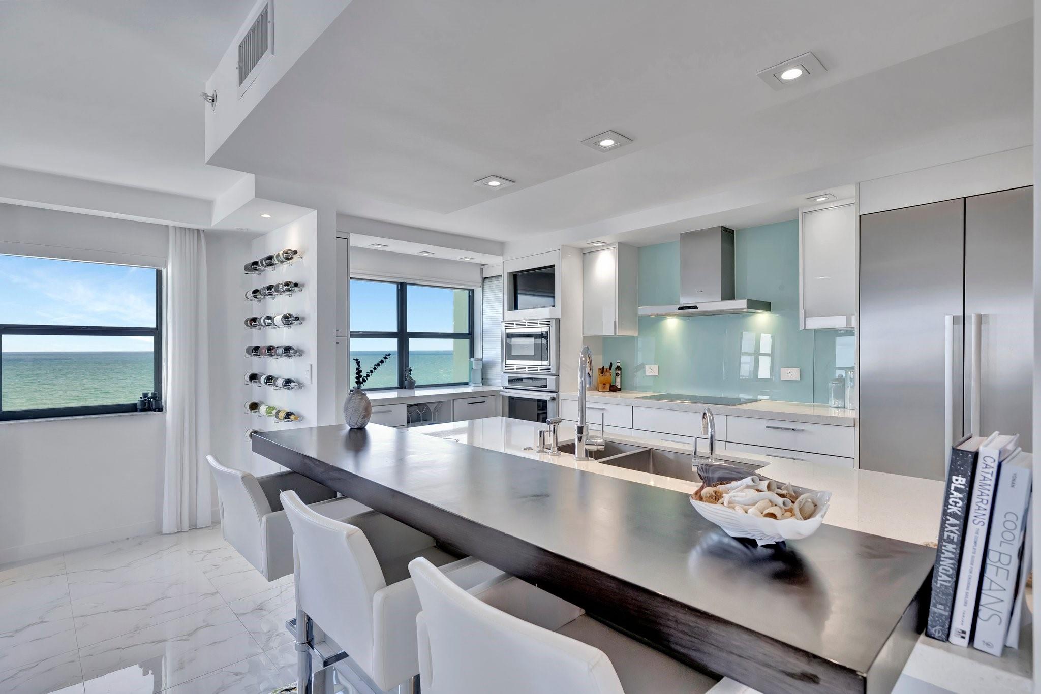 INCREDIBLE FINISH OUT WITH DIRECT OCEAN VIEWS PLUS INTRACOASTAL, LAKE AND CITY VIEWS! Private corner unit completely renovated by designer and architect! Top-of-the-line Thermador appliances, brilliant lighting, built-ins, and impact windows. Breathtaking views from this 3 bedroom treasure! HUGE primary suite, gorgeous dressing area, rain shower head, floating bench, barn door with full length mirror, dual sinks, laundry in unit, 4 flat screen TV's with internet and streaming included as well as FURNITURE! This light-filled immaculate masterpiece includes massive grounds with green space and pool deck, tons of amenities such as restaurant, 2 heated pools, 2 tennis courts, pickleball, gym, sauna, golf putting green, driving net, boccee ball, shuffle board, etc! BEST LOCATION IN SE FLORIDA!