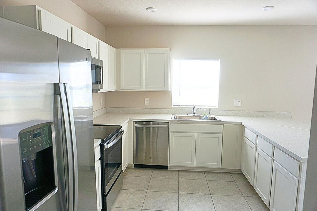 Photo of 606 Lychee Lane, Fort Pierce, FL 34981 (MLS # R11043851)