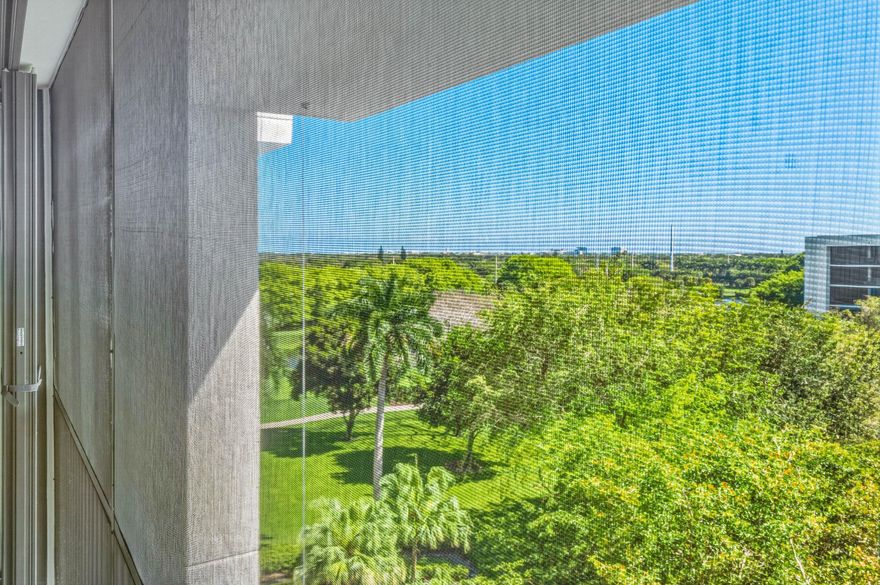 This beautifully renovated 3-bedroom, 2.5-bath top-floor condo has been updated with the finest materials and thoughtful design throughout. The home is light and bright, featuring tile flooring in the living areas and custom wood built-ins.  The kitchen offers quartz countertops, a stone backsplash, and stainless steel appliances. The third bedroom has been opened to the living area to create additional space, though the wall can easily be replaced if a separate bedroom is desired. Additional highlights include extra closets in the primary bedroom and dining area, plus a large custom pantry.  All sliding glass doors and windows are impact-resistant, and the patio also has additional hurricane shutters, allowing outdoor furniture to remain in place during storms. A new hot water heater