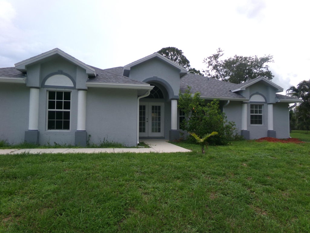 Photo of 502 SW Souris Avenue, Port Saint Lucie, FL 34953 (MLS # B26049636)