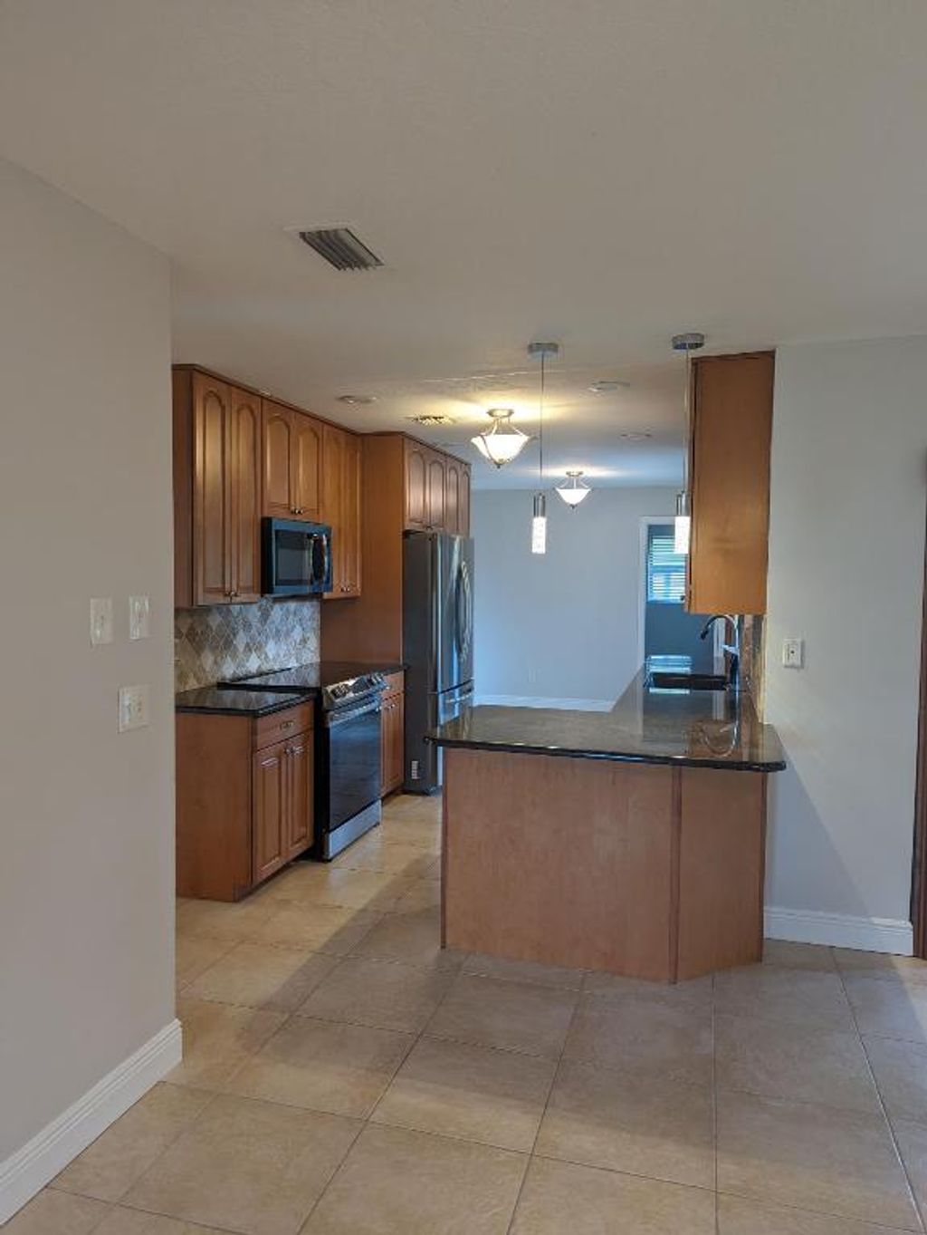 Photo of 2454 SE Pascal Avenue, Port Saint Lucie, FL 34952 (MLS # R10959827)