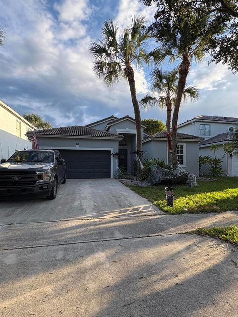 Photo of 216 Seminole Lakes Drive, Royal Palm Beach, FL 33411 (MLS # R11134697)