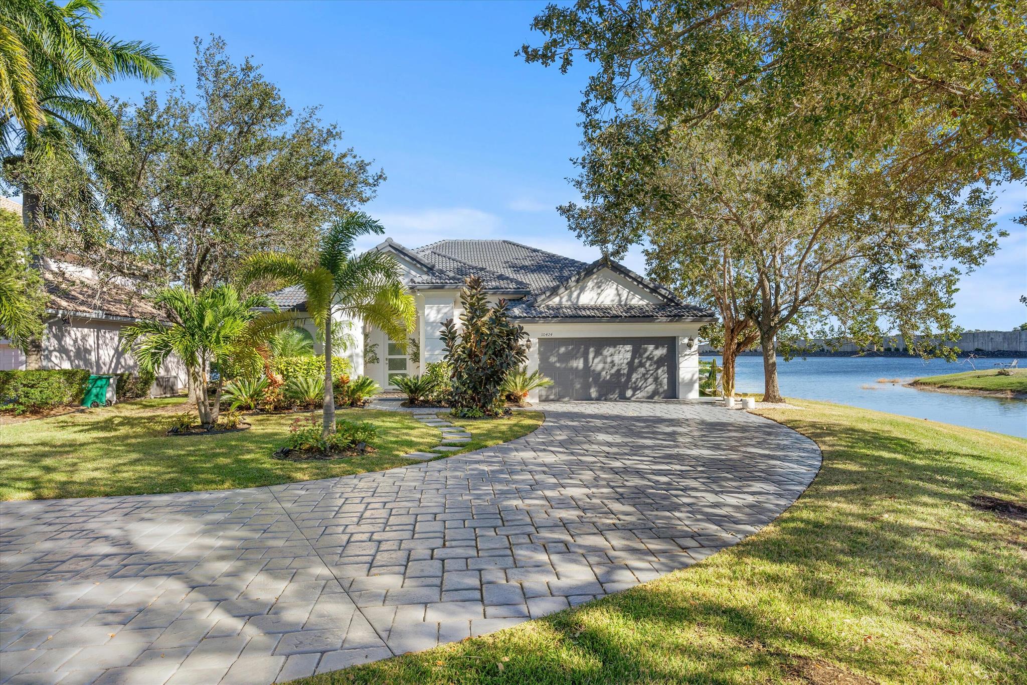 Experience luxury waterfront living in this professionally interior-designed and fully furnished home. Spanning 3,344 sq. ft., this 5-bedroom, 3-bath retreat showcases high-end finishes throughout. The open-concept interior features a modern chef's kitchen with top-of-the-line appliances, elegant living spaces with custom furnishings, and spa-like bathrooms. The primary suite offers serene water views and a luxurious en-suite bath. Outside, a resort-style pool and expansive patio create a private oasis perfect for entertaining or relaxation. This move-in-ready masterpiece seamlessly blends sophistication and comfort. Also Available for a seasonal rental