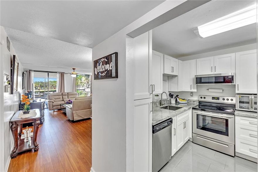 Welcome to Concord Village 9, a sought after community minutes from major highways, shopping, and restaurants, situated on a beautiful golf course. You'll love this large newly renovated corner unit with 2 bedrooms, 2 bathrooms, a large patio, and with more than generous storage. This community also offers 3 pools, clubhouse, community center, plenty of guest parking, and elevators. All ages welcome in this building!! Wi-Fi also included in maintenance fee.