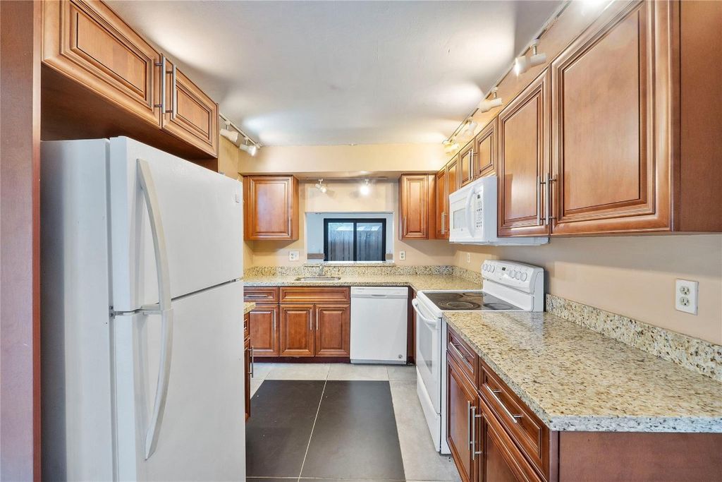 Photo of 2157 NW 37th Ave #2157, Coconut Creek, FL 33066 (MLS # F10538240)