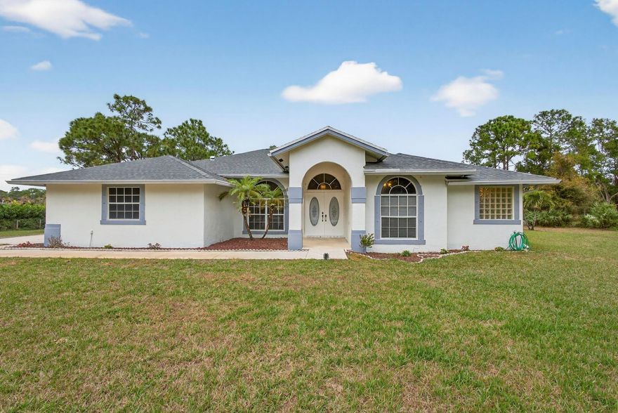 Come take a look at your DREAM HOME that has it ALL! This great property is move in ready and PRICED TO SELL! It has 5 oversized bedrooms and 3 full bathrooms, with tile floors throughout and NO carpet AND NO stairs! It’s very spacious with its open concept and soaring ceilings. It has a gorgeous large screened pool, two car garage and parking for many cars, boat or RV if you wish. It is all situated on over an acre of land with a sprinkler system! It has no HOA and plenty of land to do as you wish. New roof in 2024, and new a/c in 2021. Freshly painted in 2025. Shops and restaurants nearby with new ones being built. Come take. Look, you will NOT be disappointed!