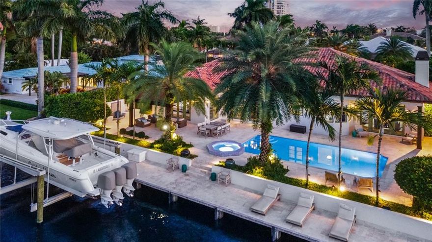 This architectural masterpiece welcomes you with perfectly manicured gardens and deep water ocean access in the desired Harbor Beach, offering privately secured Beach Club and Marina. Step through the wrought-iron doors and into this Palm Beach-inspired all-one-level home customized to perfection, featuring 4 Bedrooms + an Office pre-wired for a media room, incredible detail in it’s volume ceilings and millwork throughout, sensational Master Bedroom and Bathroom with Steam shower, State of the art closets, Control 4 Home automation, Full house Generator, Stunning Gourmet Kitchen with Wolfe Appliances and exclusive Grohe facuet for still & sparkling refreshments, Landscape lighting, Spa and Salt water pool,24,000lb Neptune Boat lift and premier dockage for your yacht, minutes to the ocean.