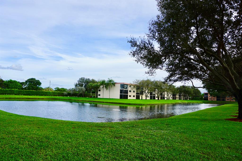 LOCATION LOCATION!! Fabulous views of lake, from large screened and/or glassed in terrace, with an elevator make this condo a perfect place to call home! Pristine, 2 bedrooms, 2 full baths, open kitchen with a nice ''eat in'' area, new stainless refrigerator, new a/c, a nice size laundry & utility room, great views of lake from everywhere! Well kept, can be purchased with/without furnishings. Truly Immaculate,bring a toothbrush & move right in, just in time for season! Enjoy the Grande Clubhouse, pools, tennis, pickleball, bocce ball, fitness room, clubs, organizations, shows, parties, card rooms, & this 55+ community has so much more! This building has its own satellite pool & tennis in addition! Private parking space. Close to loved Atlantic ave beach, dining, shopping, hospital Love it!