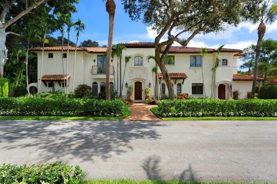 On an rare oversized landscaped corner lot, this elegant remastered estate has been recently enhanced with new modern Downview kitchen with top of the line Miele and Wolf gas stove/double oven and completely renovated in 2008. The oak tree-canopied uplit landscape grounds creates a lush oasis for the large entertain loggia with summer kitchen and resort-style pool. A Clusia hedge boarded the Chicago brick motorcourt that leads to the side entry 3 bay garage.