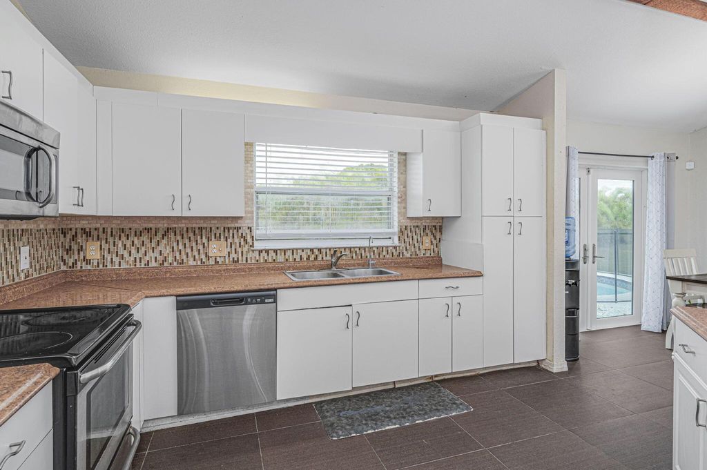 Photo of 563 SW Bradshaw Circle, Port Saint Lucie, FL 34953 (MLS # R10973100)