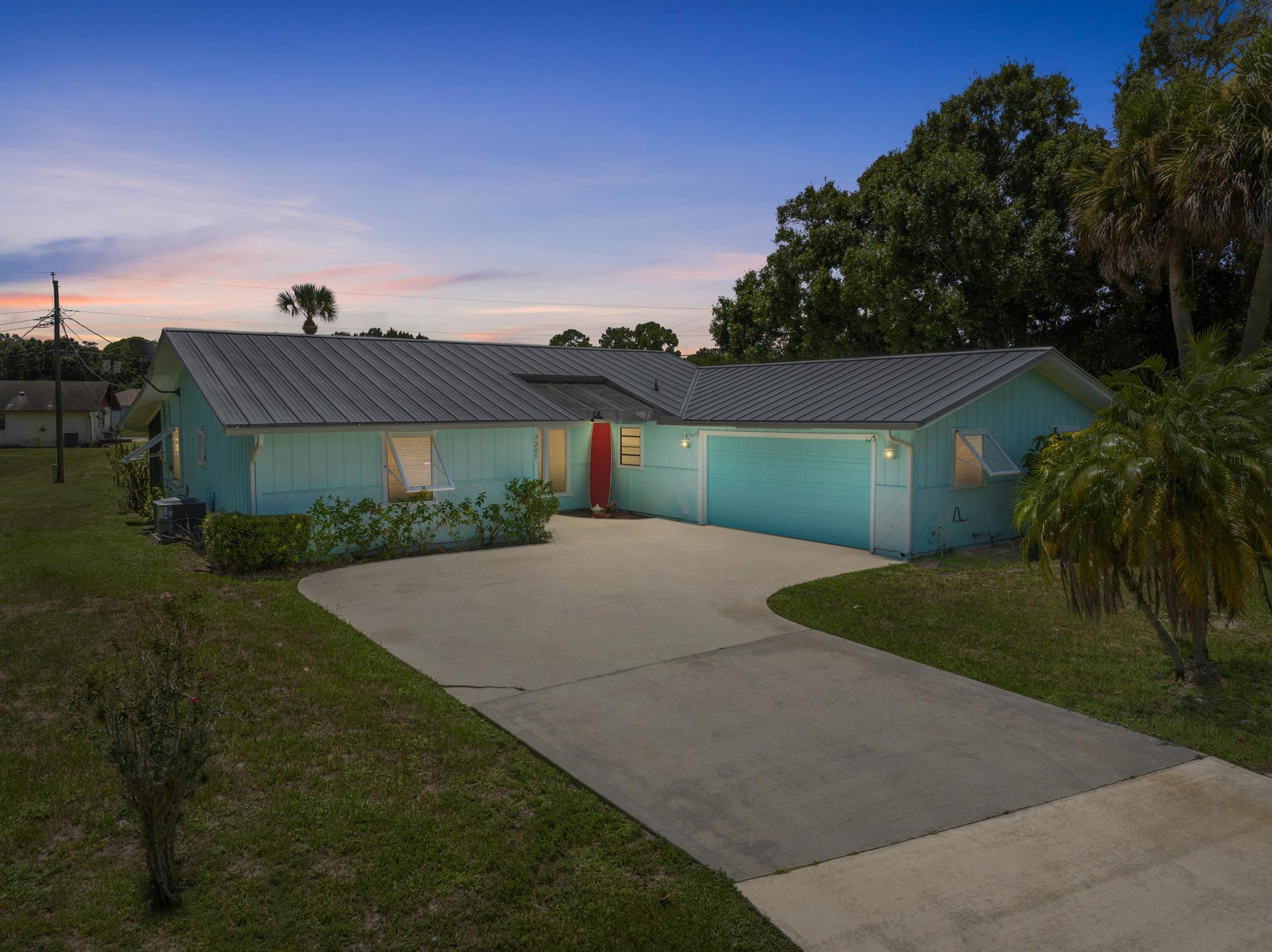 Room for your boat, RV, and more! Tucked into the welcoming Lakewood Park community, this charming 3-bed, 2-bath home plus a bonus den (possible 4th bed conversion) blends comfort and coastal living. A metal roof and Bahama shutters add style and durability, while the bright, open interior features tile and laminate throughout and a kitchen with stainless steel appliances. The private primary suite offers a peaceful retreat, and the spacious backyard is perfect for morning coffee or sunset gatherings. Just minutes from shopping, dining, and the sparkling Treasure Coast beaches, you'll enjoy the best of small-town charm with easy access to it all.