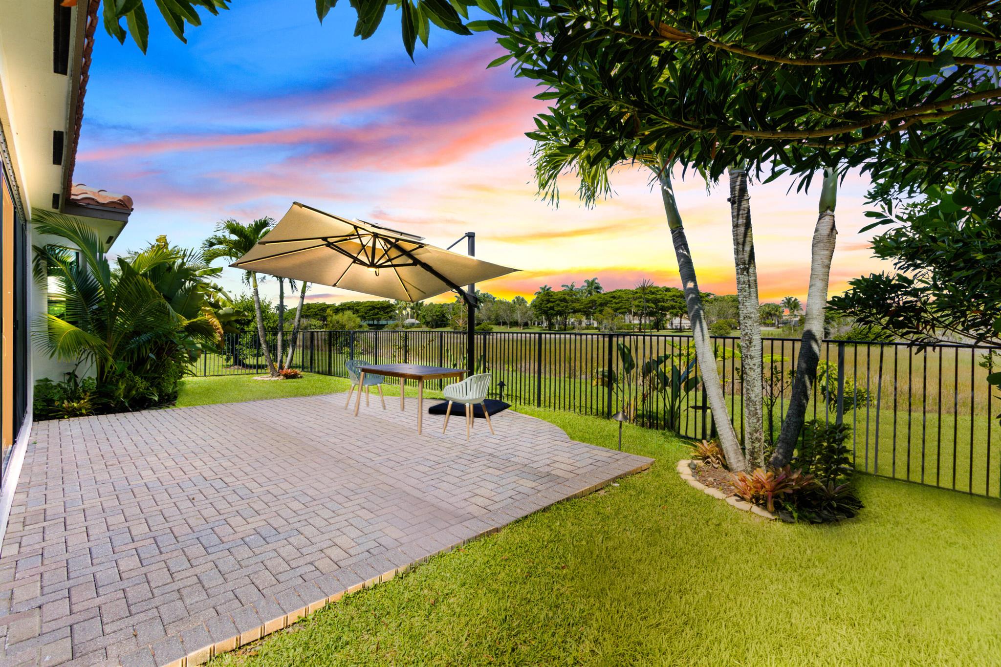 HOME FOR SALE: Welcome to this meticulously maintained and upgraded 3-bedroom, 3-bathroom home with a 2-car garage, perfectly situated in the highly sought-after, gated community of Portosol in Royal Palm Beach. This property offers a unique blend of resort-style living with the tranquility of a private, nature-filled backyard with a view of a nature preserve. Step inside to an open and inviting floor plan, where the kitchen, living room, and dining areas flow seamlessly together, creating an ideal space for entertaining and family life. The home's interior has been recently updated with a full professional repaint, providing a fresh and clean canvas. The most significant recent addition is a stunning 258 sqft sunroom, a true haven for year-round enjoyment.
