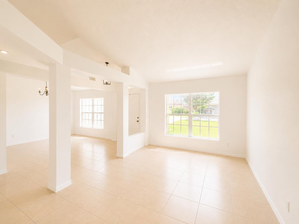 Photo of 1061 SW Coleman Avenue, Port Saint Lucie, FL 34953 (MLS # B26061485)